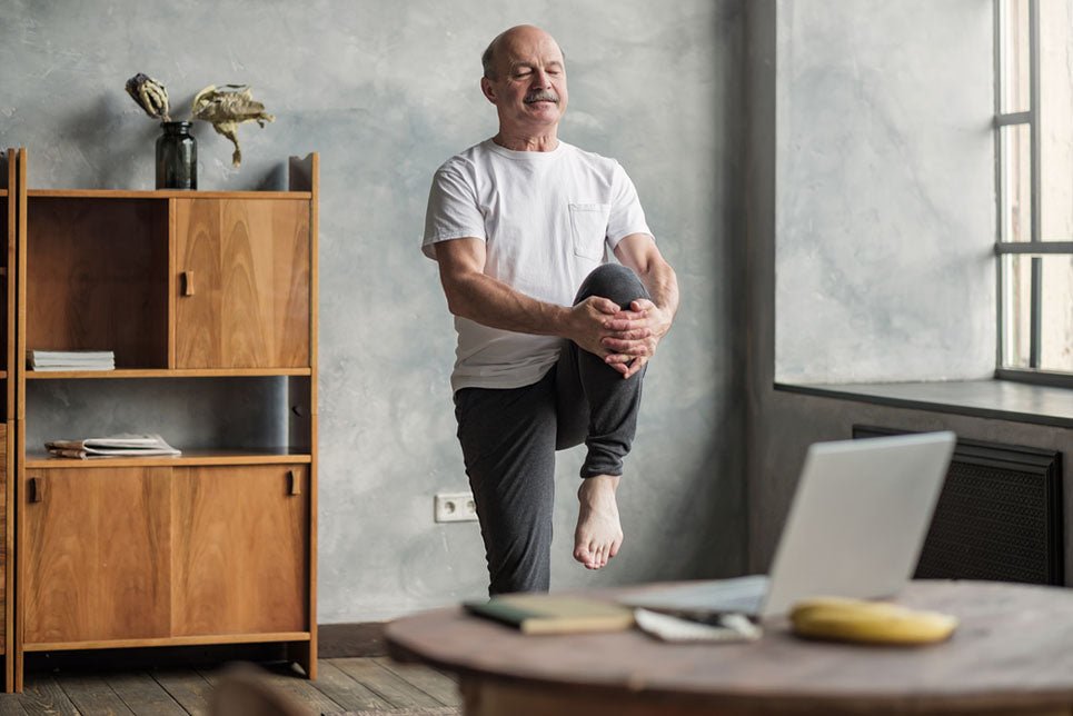 senior man stretching in yoga pose