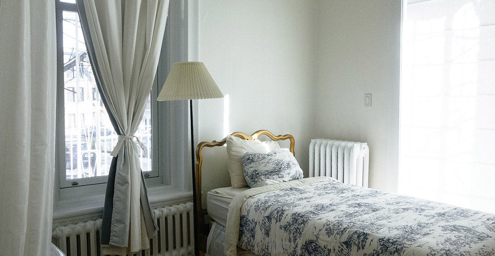 Picture of bed perfectly made in bedroom